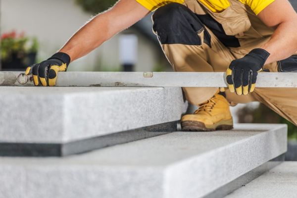 Countertop installation team checking the finished surface in a home